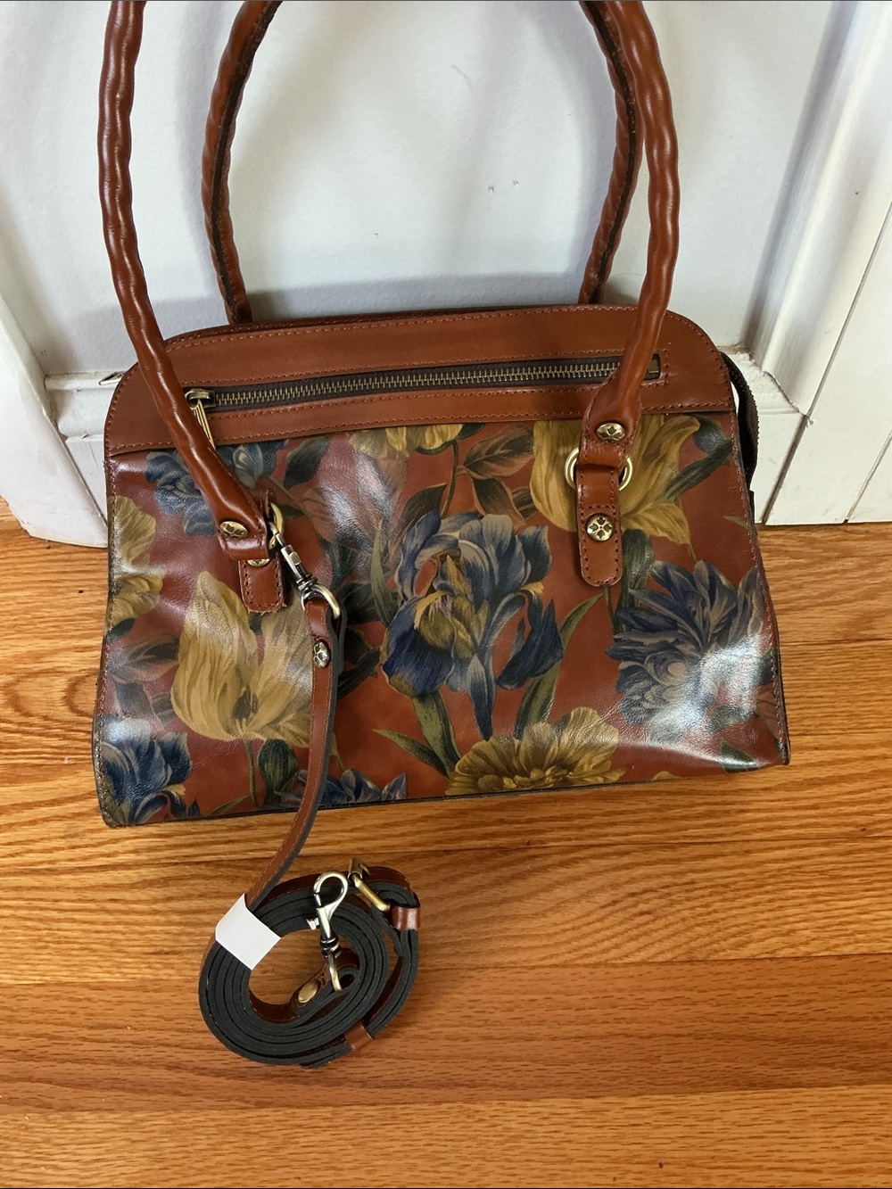 Patricia Nash Calvi handbag features a vibrant floral leather design. NWT.